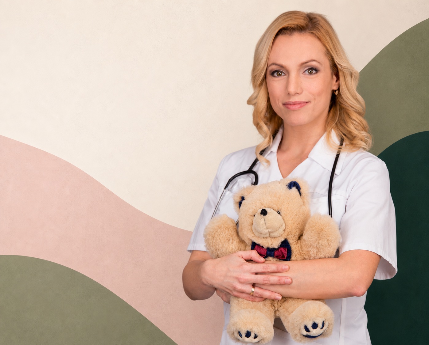 Dr Gabriella Wéber holding a teddy bear